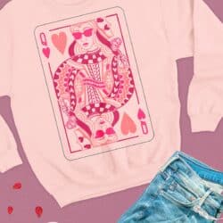 A pink sweatshirt with a valentine's card on it.
