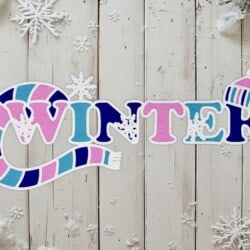 The word "Winter" with a scarf and hat design on a wooden background, surrounded by snowflakes.