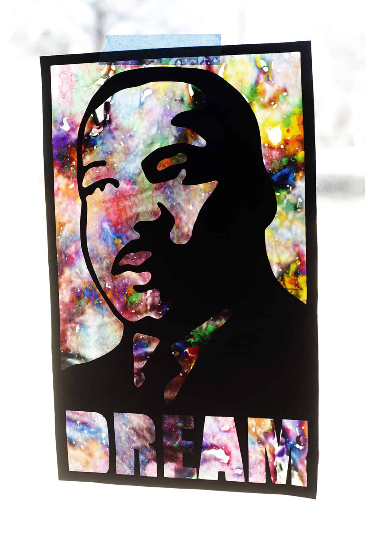 A vibrant children's art piece featuring Martin Luther King Jr., crowned with the word "dream.