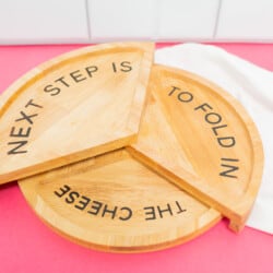 Schitt's Creek Cheese Board that has wood etched with "Next step is to fold in the cheese."