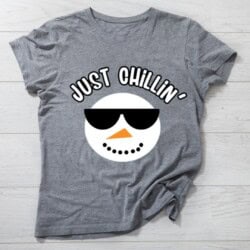 Gray t-shirt with a snowman face wearing sunglasses and the text "Just Chillin'" printed above.