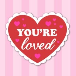 You're loved sticker on a striped background.